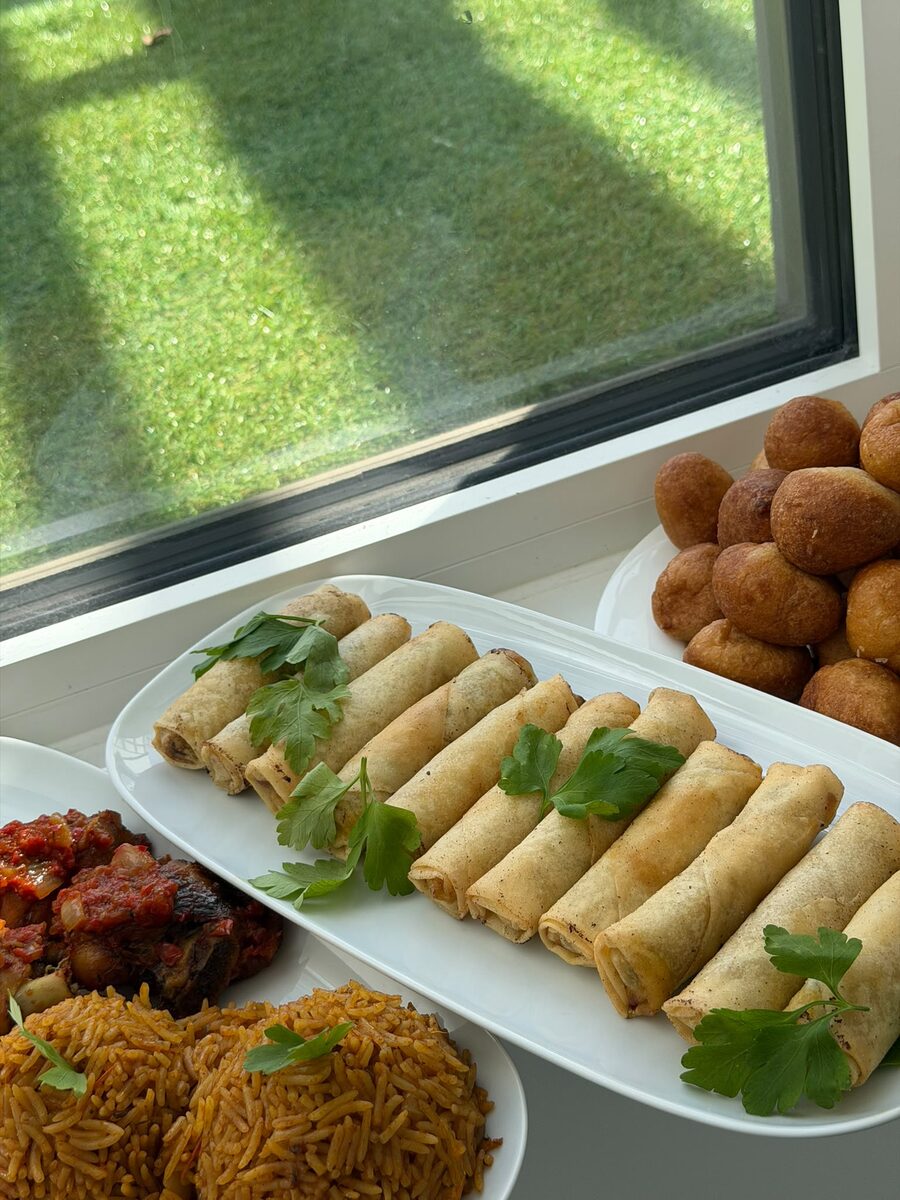 Small chops spread with jollof and puff puff